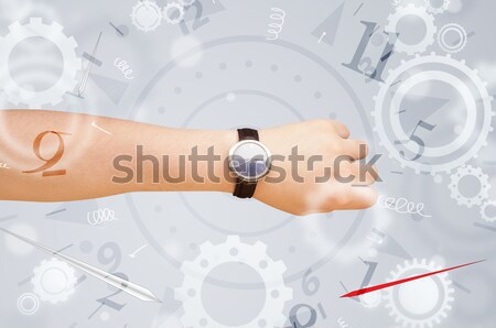 Hand with watch and numbers on the side comming out Stock photo © ra2studio