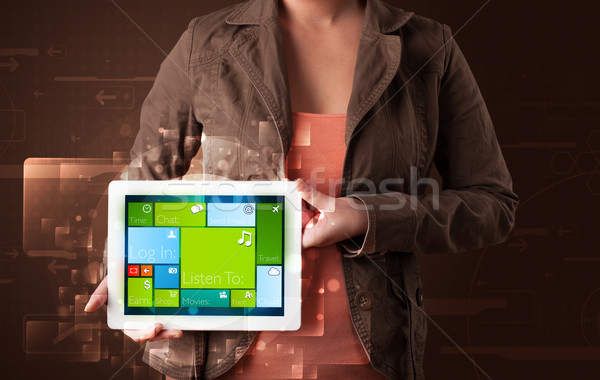 Lady holding tablet with modern software operational system Stock photo © ra2studio