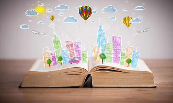 Stock photo: cityscape drawing on open book