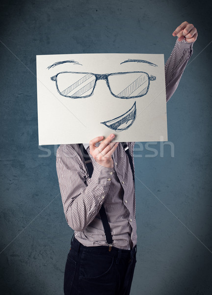 üzletember tart papír mosolygós arc fiatal fej Stock fotó © ra2studio