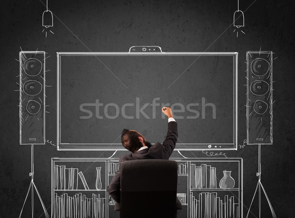 Businessman in front of a home cinema system Stock photo © ra2studio
