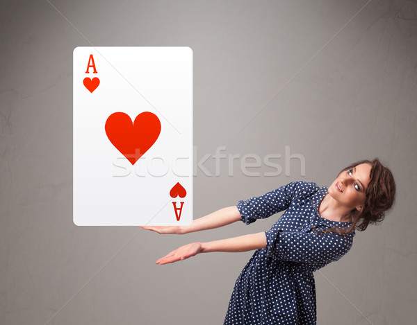 Beautifu woman holding a red heart ace Stock photo © ra2studio