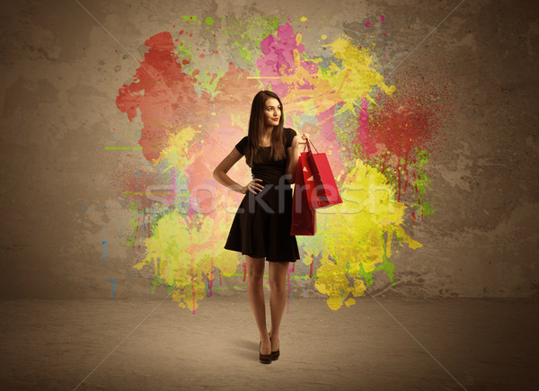 Girl with shopping bags and paint splatter Stock photo © ra2studio