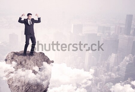 Zakenman rock berg wereldbol permanente rand Stockfoto © ra2studio