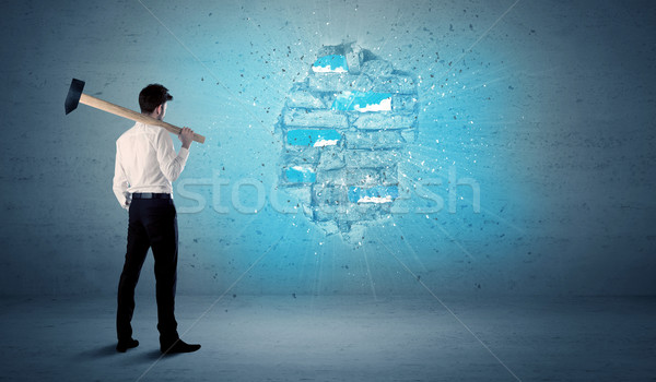 Business man hitting brick wall with huge hammer Stock photo © ra2studio