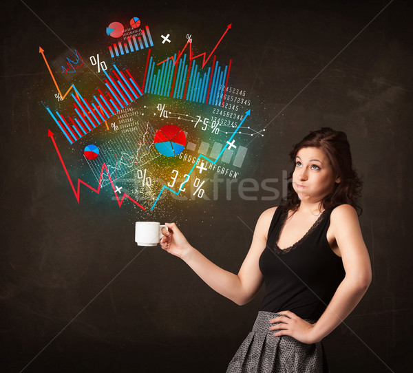 Businesswoman holding a white cup with diagrams and graphs Stock photo © ra2studio