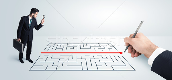 Business man looking at hand drawing solution for maze  Stock photo © ra2studio