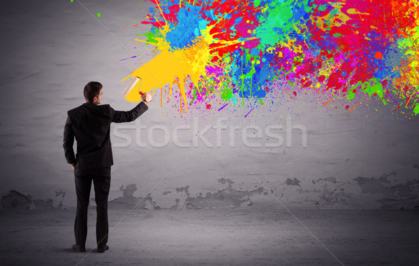 Sales person painting colorful splatter Stock photo © ra2studio