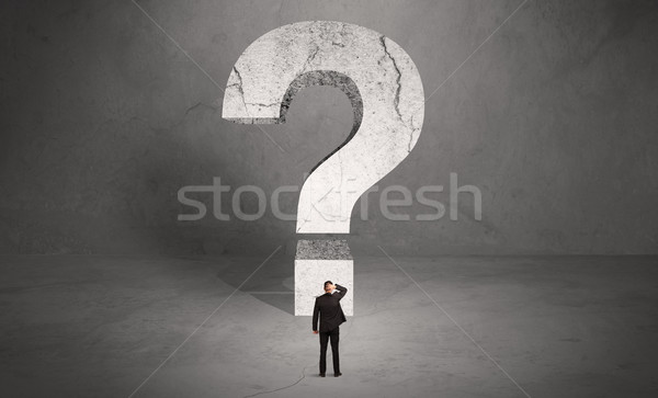 Confused businessman and big question mark Stock photo © ra2studio