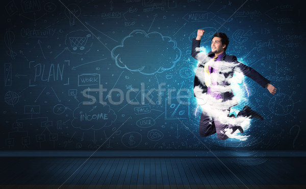 Heureux homme d'affaires sautant tempête nuage autour [[stock_photo]] © ra2studio