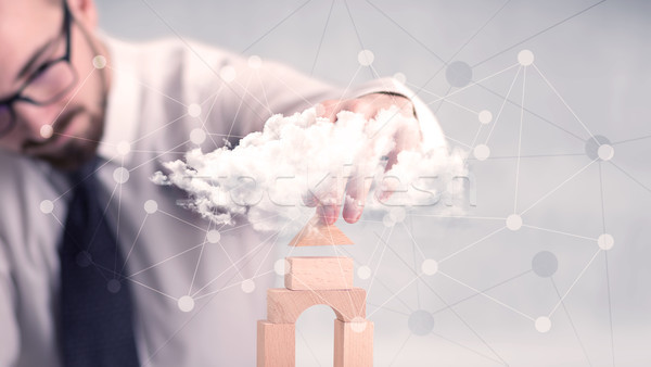 Businessman building a tower Stock photo © ra2studio