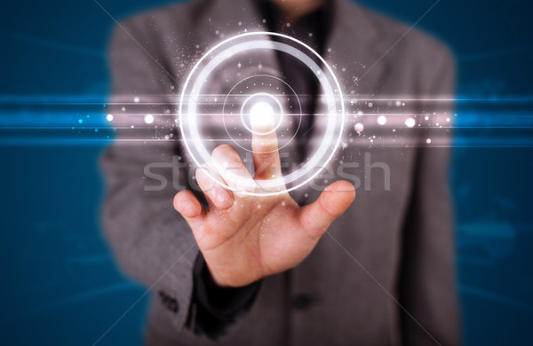 Businessman pressing high tech type of modern buttons  Stock photo © ra2studio