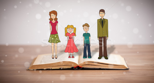 Drawing of a happy family on opened book Stock photo © ra2studio