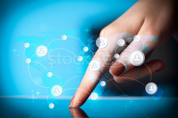 Hand touching tablet pc, social network concept Stock photo © ra2studio