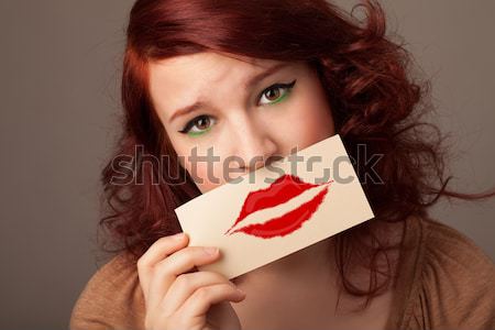 Heureux jolie femme carte baiser rouge à lèvres [[stock_photo]] © ra2studio