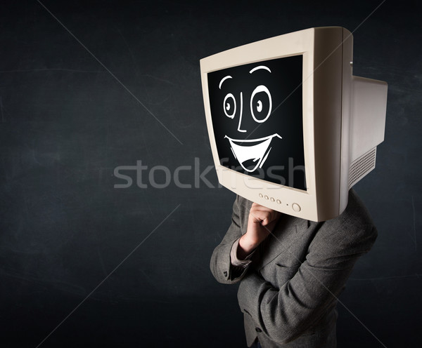 Happy businessman with a PC monitor head and a smiley face Stock photo © ra2studio