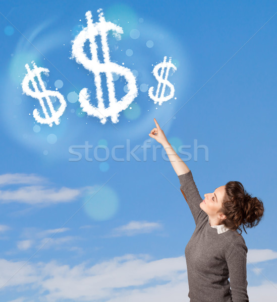 Młoda dziewczyna wskazując znak dolara chmury Błękitne niebo działalności Zdjęcia stock © ra2studio