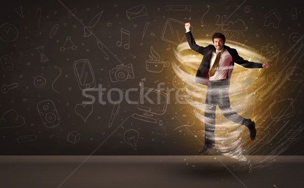 Stock photo: Happy businessman jumping in tornado concept