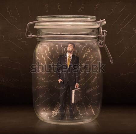 Businessman inside a jar with powerful hand drawn lines concept Stock photo © ra2studio