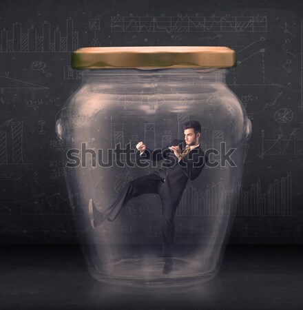 Business man closed into a glass jar concept Stock photo © ra2studio