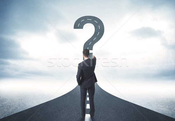 Stock photo: Business person lokking at road with question mark sign