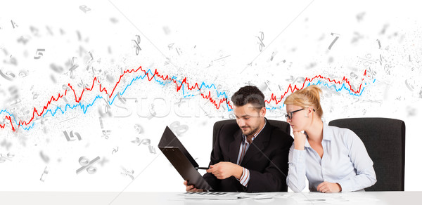 Geschäftsmann Frau Sitzung Tabelle Aktienmarkt Grafik Stock foto © ra2studio