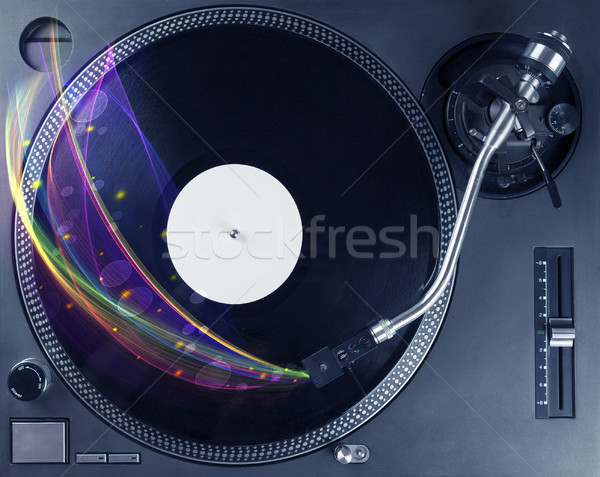 Stock photo: Turntable playing vinyl with glowing abstract lines
