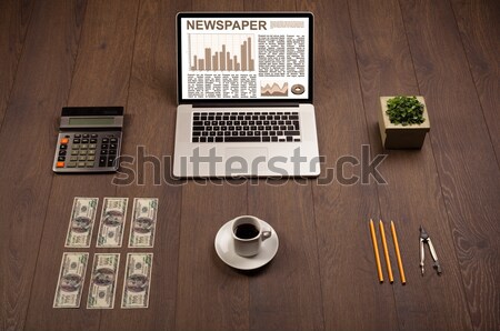 Laptop on office desk with business website on screen Stock photo © ra2studio