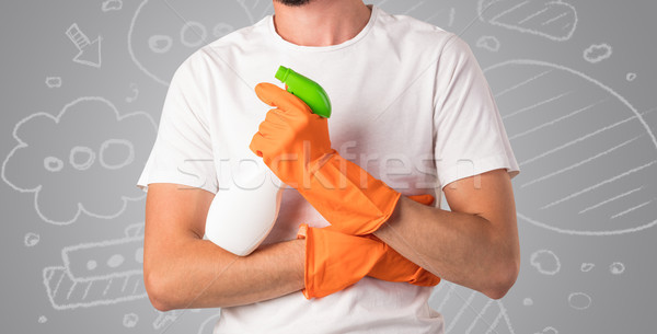 Male housekeeper with grey doodled wallpaper Stock photo © ra2studio