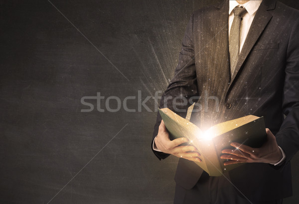 Man holding a book. Stock photo © ra2studio