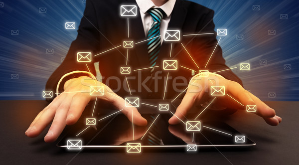 Typing with connected communication icons around Stock photo © ra2studio
