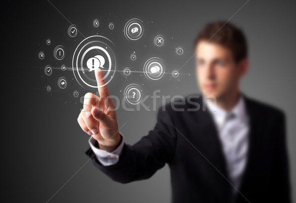 Businessman pressing modern social type of icons Stock photo © ra2studio