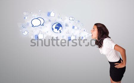 Jolie femme regarder réseau social icônes résumé nuage [[stock_photo]] © ra2studio