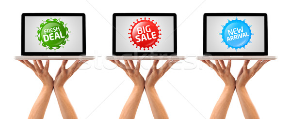 Hand holding laptop with Colorful sale label collection Stock photo © ra2studio