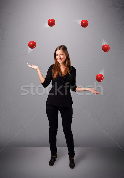 Jeune fille permanent jonglerie rouge joli [[stock_photo]] © ra2studio