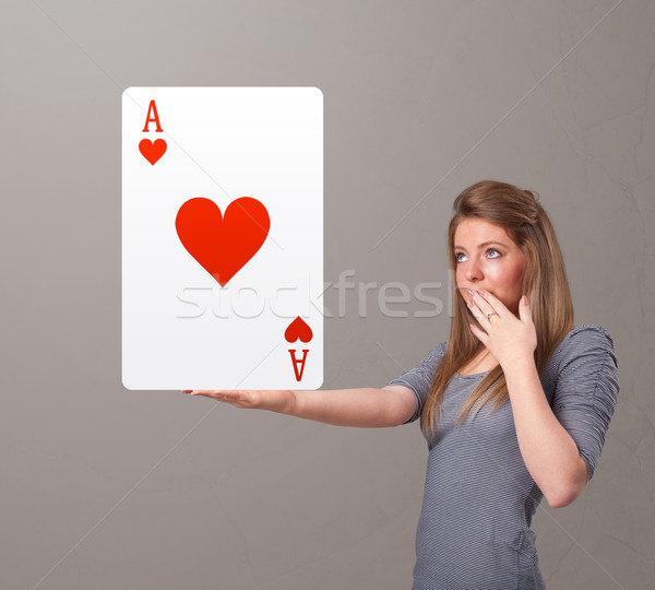 Beautifu woman holding a red heart ace Stock photo © ra2studio