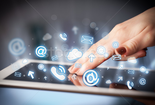 Stock photo: Hand touching tablet pc, social media concept