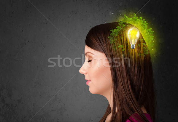 Stock photo: Young mind thinking of green eco energy with lightbulb