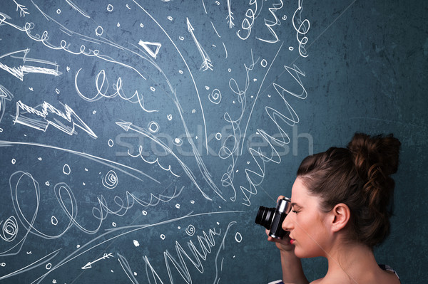 Photographer shooting images while energetic hand drawn lines an Stock photo © ra2studio
