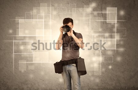 Male holdig professional camera with lens Stock photo © ra2studio