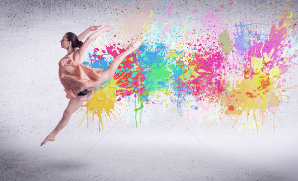 Modern street dancer jumping with colorful paint splashes Stock photo © ra2studio