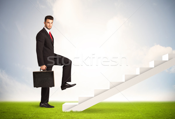 Business person climbing up on white staircase in nature Stock photo © ra2studio
