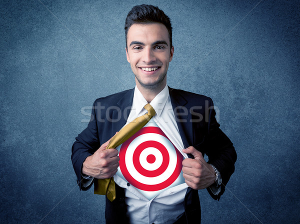 Businessman tearing shirt with target sign on his chest Stock photo © ra2studio