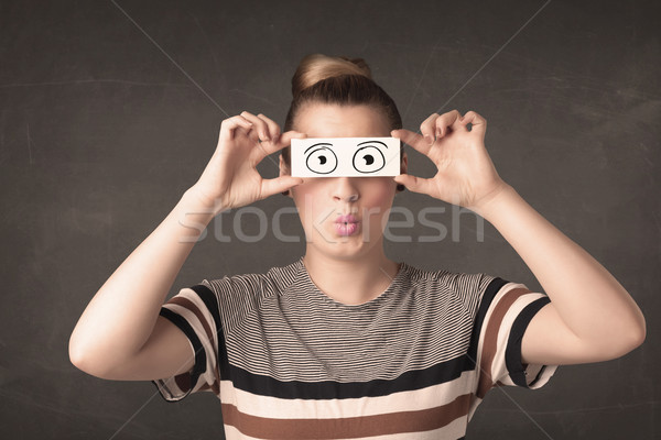 Funny woman looking with hand drawn paper eyes Stock photo © ra2studio