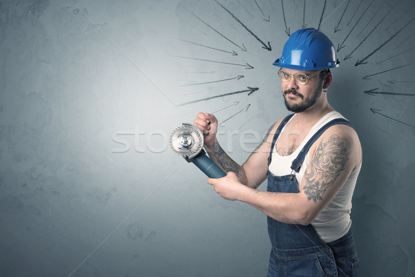 Stock photo: Worker standing with tool.