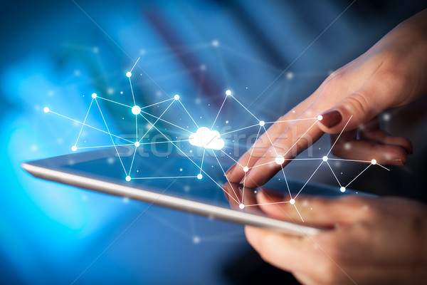 Fingers touching tablet with cloud concept Stock photo © ra2studio