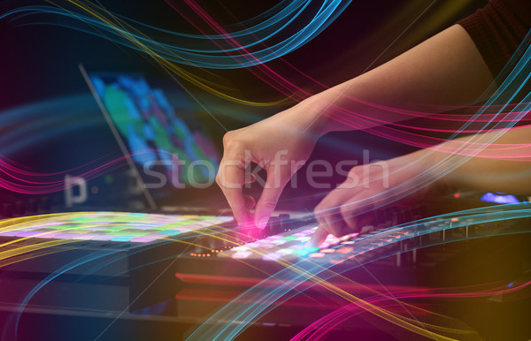Hand mixing music on midi controller with colorful vibe concept Stock photo © ra2studio