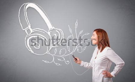 young woman singing and listening to music with abstract headphone Stock photo © ra2studio