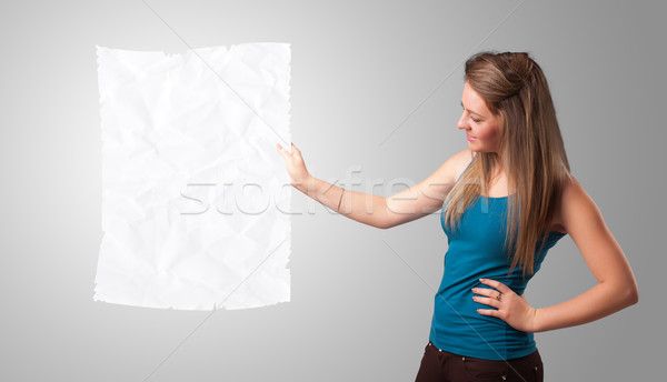 Young girl holding crumpled white paper copy space Stock photo © ra2studio