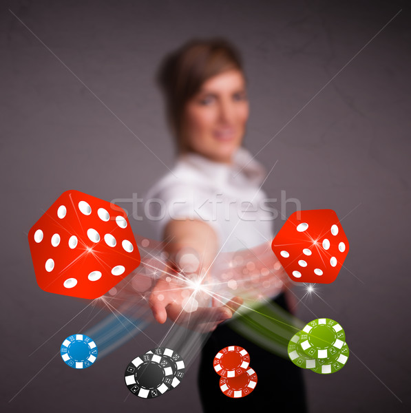 Young woman throwing dices and chips Stock photo © ra2studio